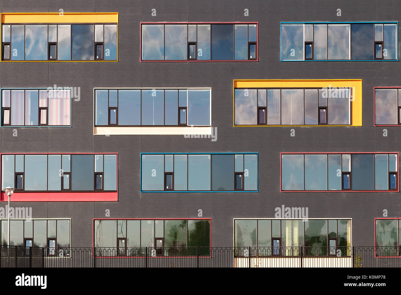 colored windows of the building. geometric background. building's facade. Stock Photo