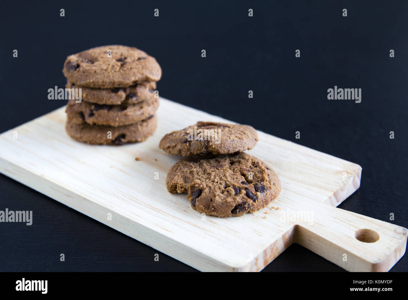 Chocolate Chip Cookies on chopping wood Stock Photo