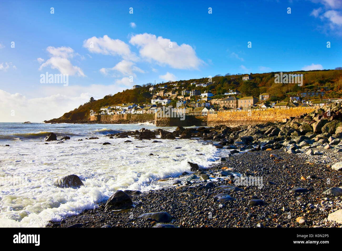 A view along the pebbled coast of Mousehole, Cornwall, UK Stock Photo