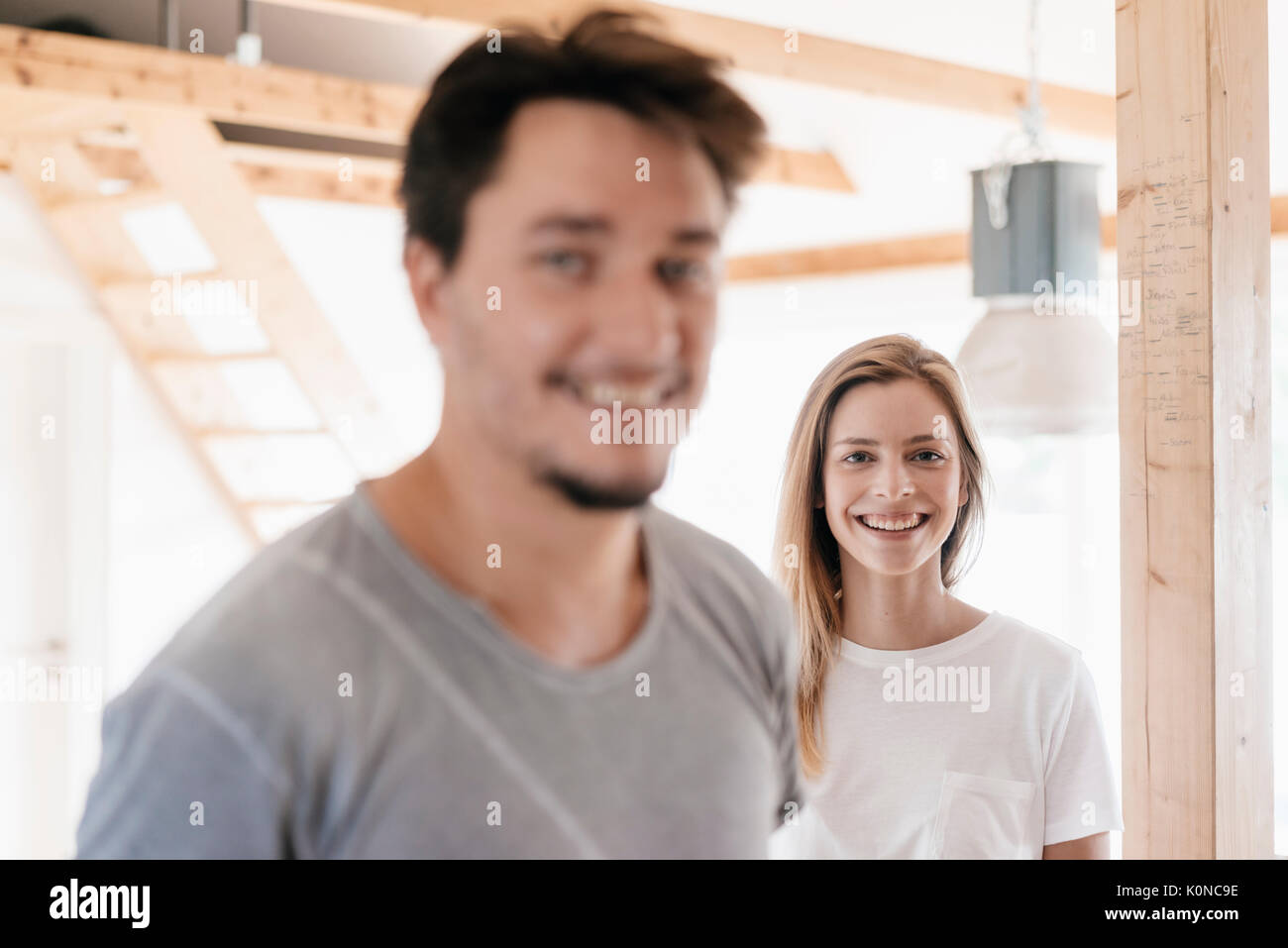 Smiling couple in their new home Stock Photo - Alamy