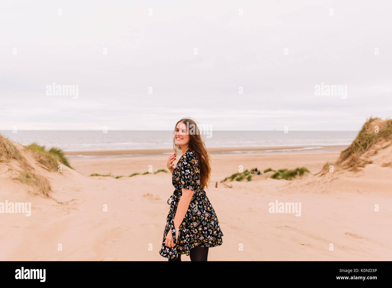 Portrait of smiling you young woman  on the beach Stock Photo