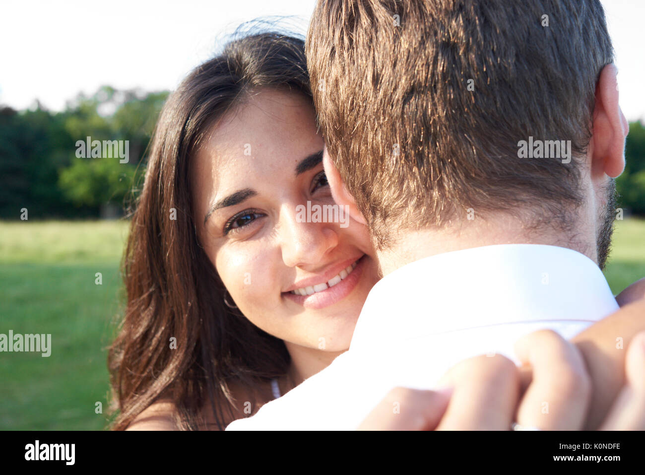 Hampstead Heath, London, UK, happy girlfriend looking at camera, couple sunset at park Stock Photo