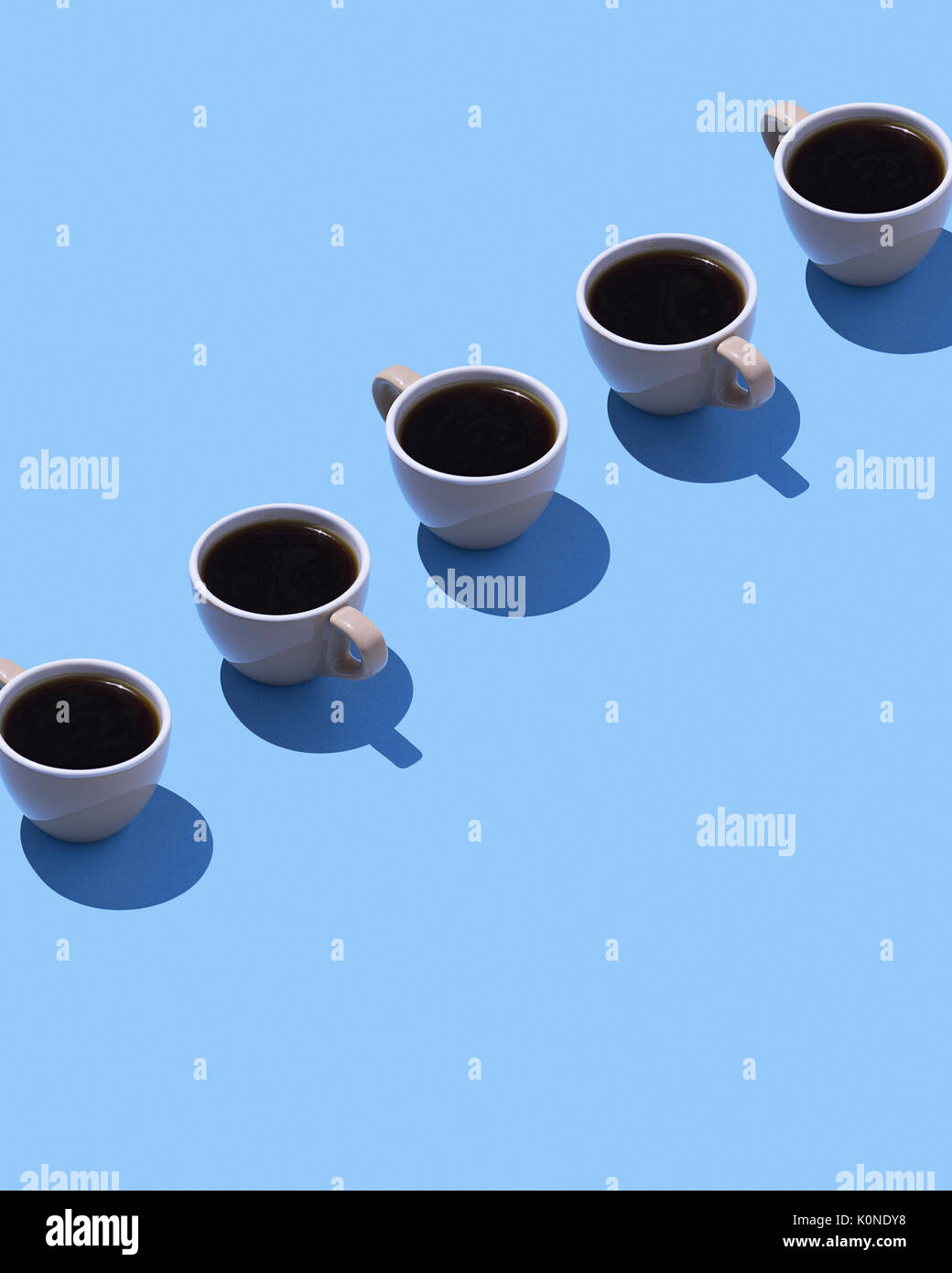 Five coffee cups on light blue ground, 3D Rendering Stock Photo