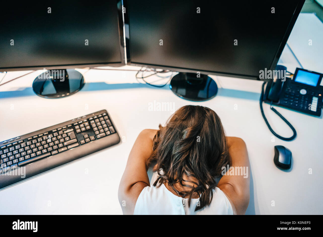 Exhausted businesswoman sleeping on desk Stock Photo - Alamy