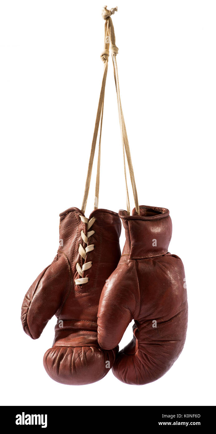 Isolated vintage boxing gloves hanging against white background Stock Photo  - Alamy