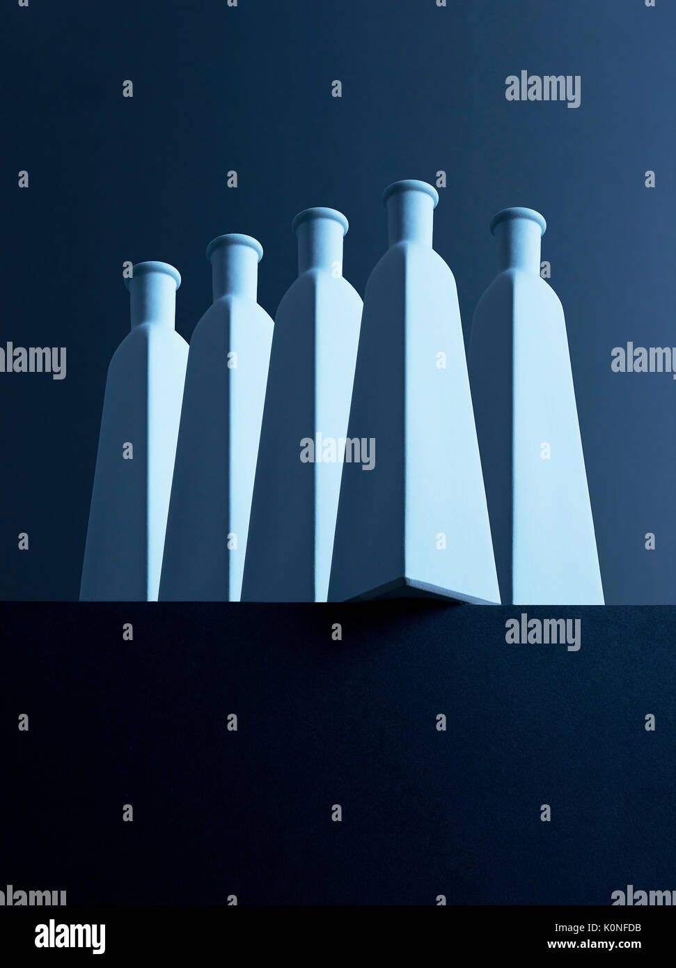 Multiple bottles organized neatly over a dark background Stock Photo