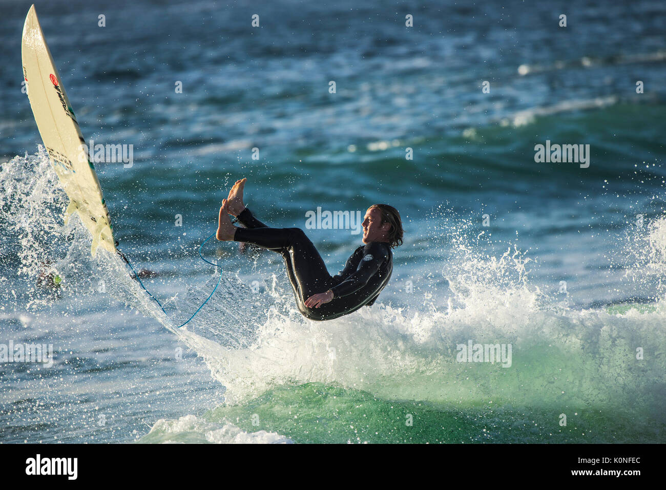 A wipe out for a surfer at Fistral beach in Newquay. Stock Photo