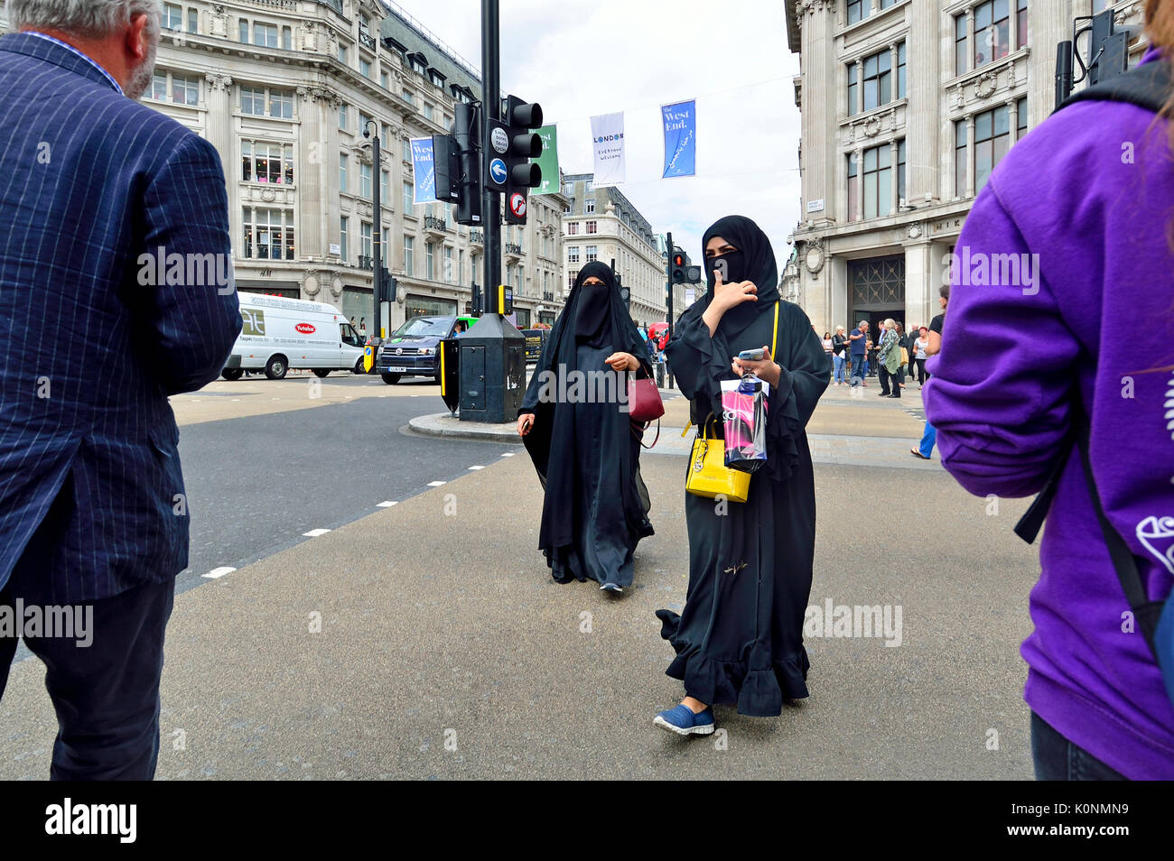 London, England, UK. Muslim women in Oxford Circus wearing a hijab and