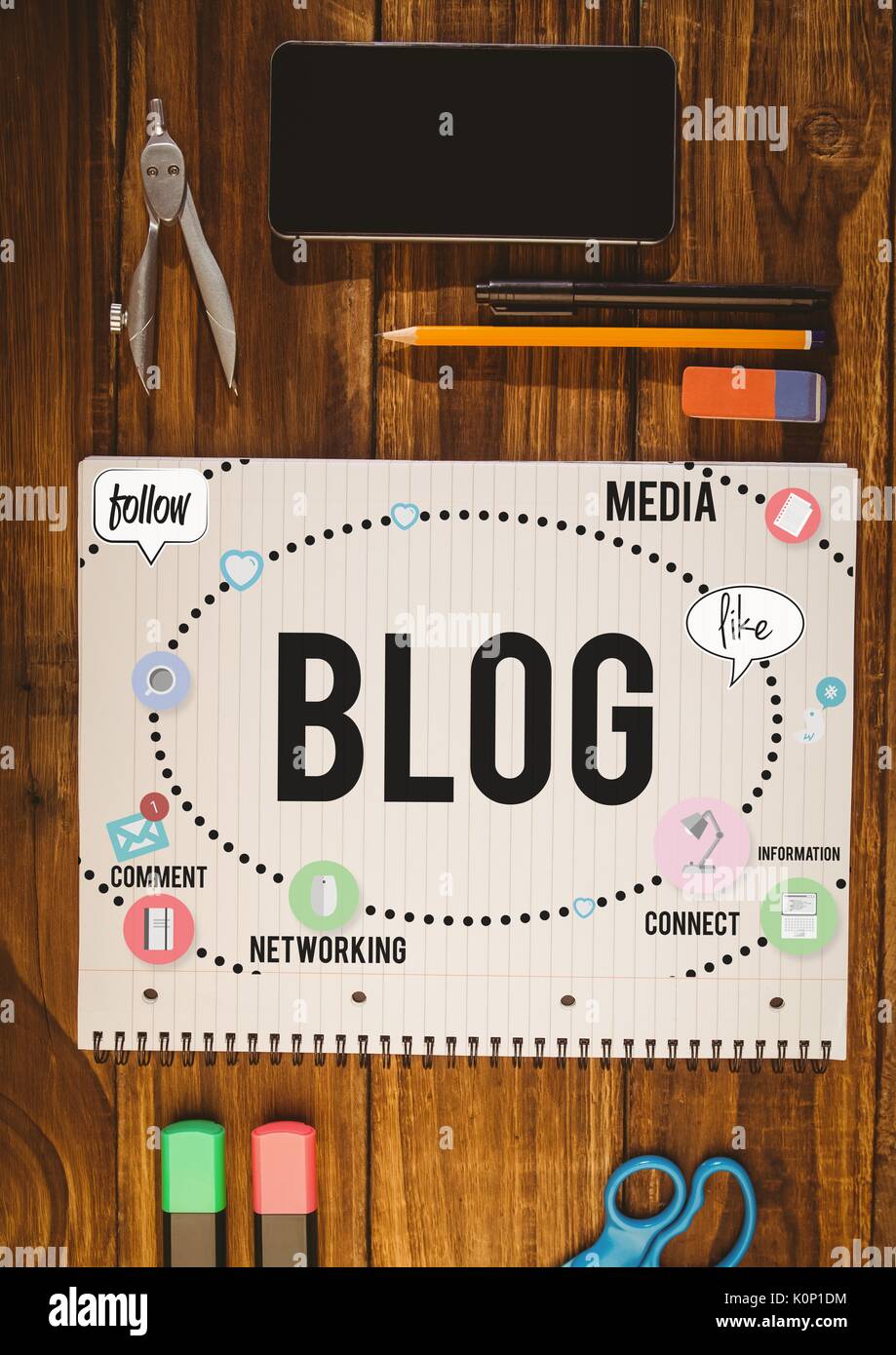 Digital composite of Table top with a notebook with web graphics Stock Photo