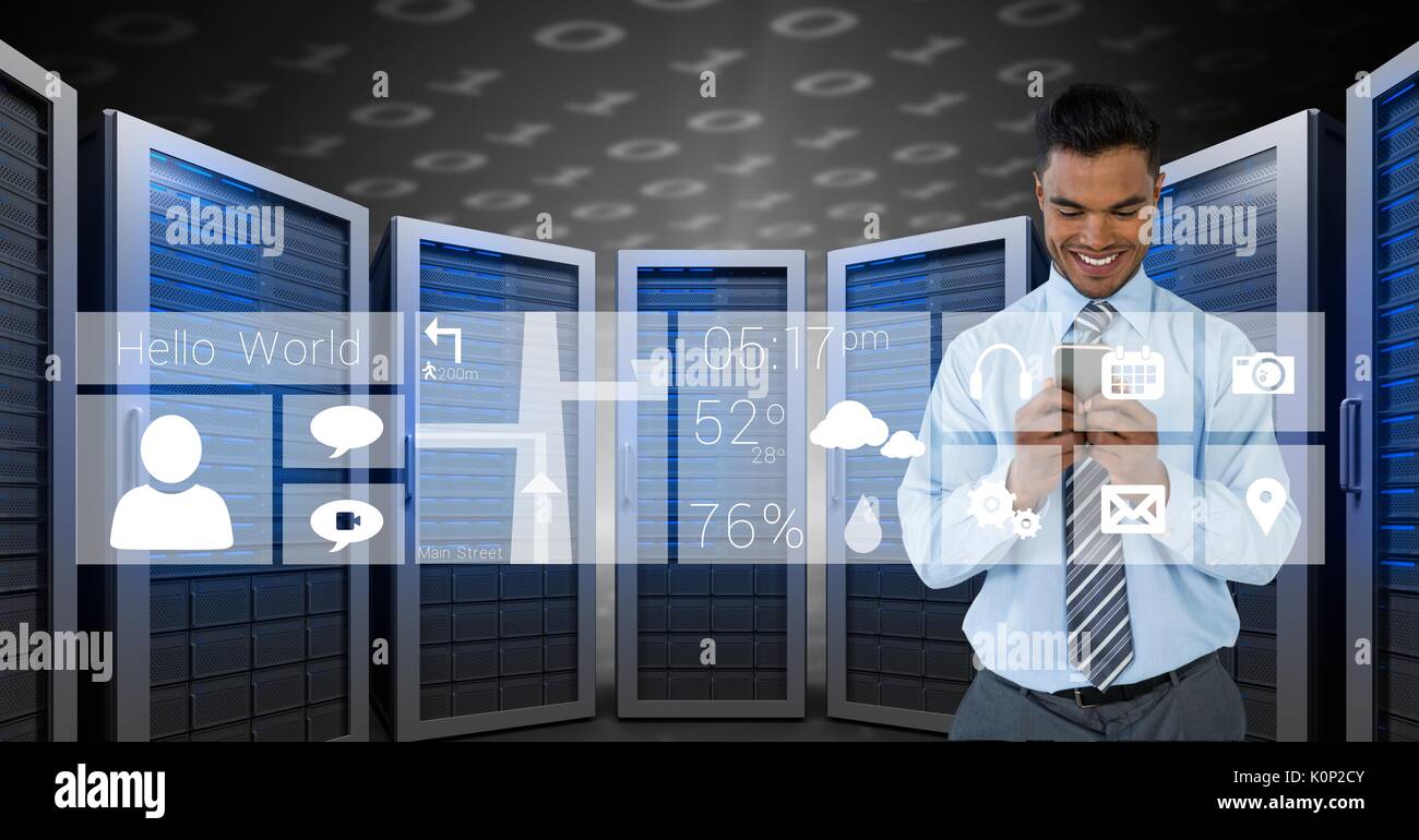 Digital composite of Happy business man holding a phone and graphics in server room Stock Photo