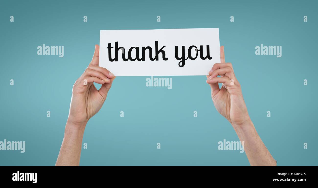 Digital composite of Business woman holding a card with thank you text ...