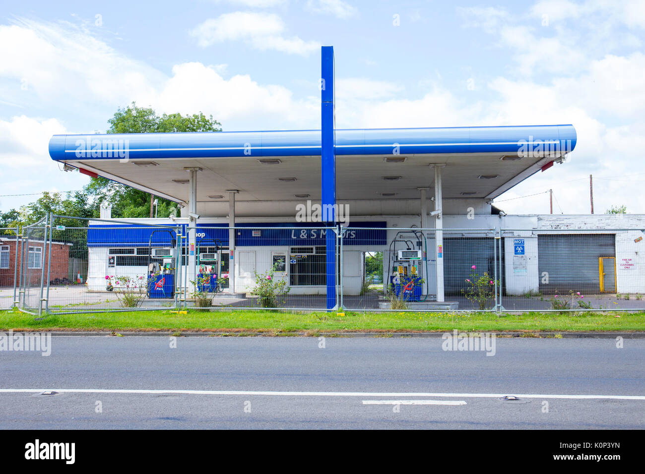 Closed down garage with petrol station in Cheshire UK Stock Photo