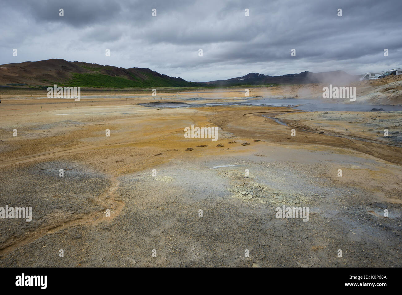 Iceland - Hot spring and mud pots at geothermal area hverir near myvatn and green volcanoes Stock Photo