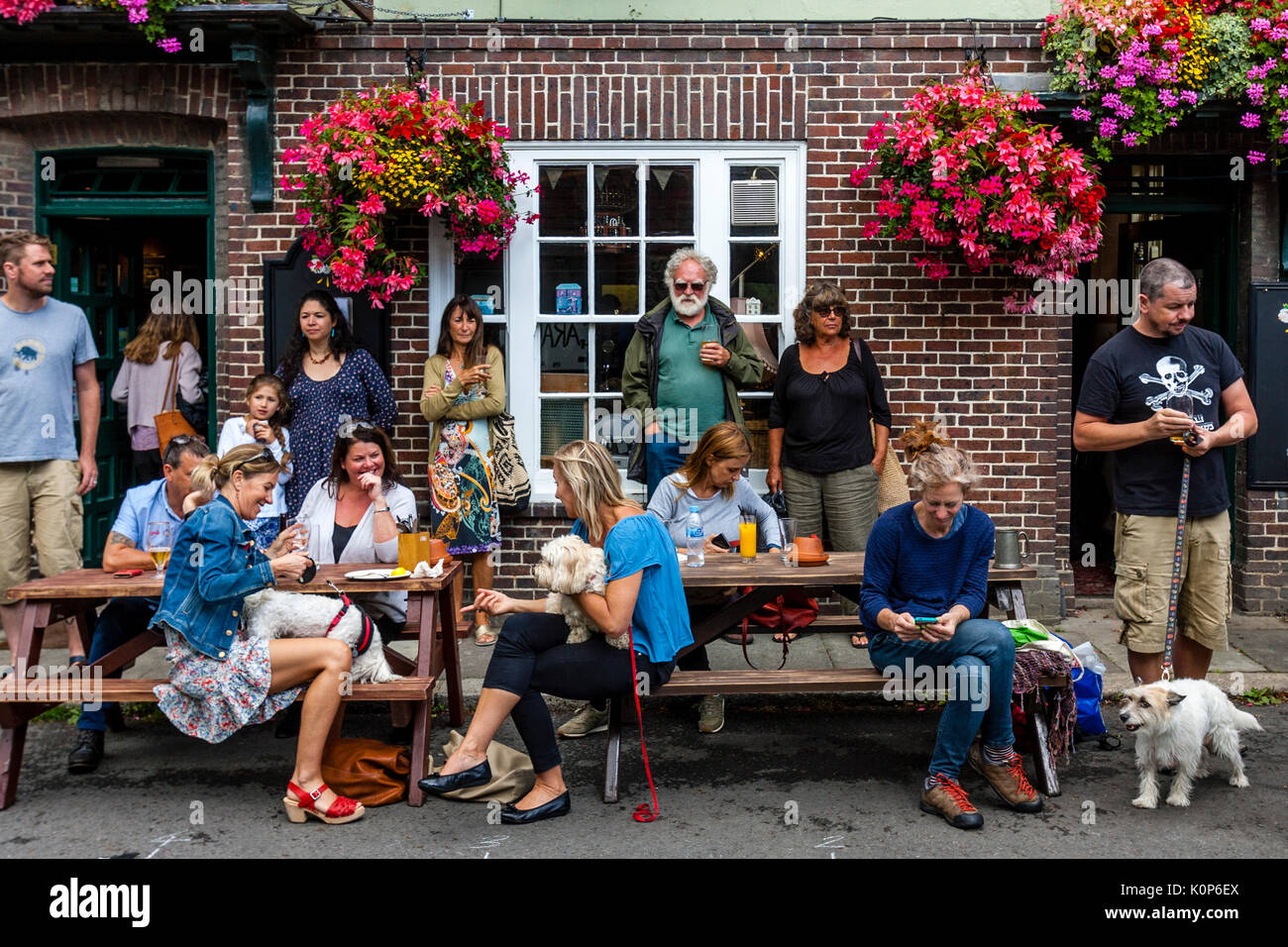 People Drinking and Socialising Outside The Snowdrop Pub, Lewes, East Sussex, UK Stock Photo