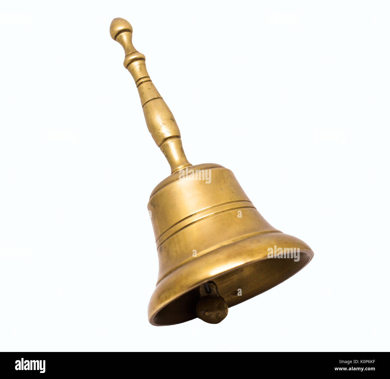 Old bronze hand bell cut out on white background Stock Photo