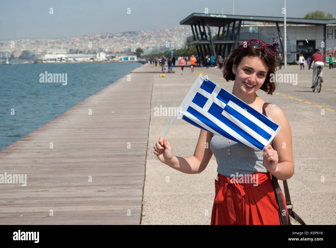 Salonika, Greece. March 25, national holiday (1821  liberation from the turk empire ). A young woman with greek flag Stock Photo
