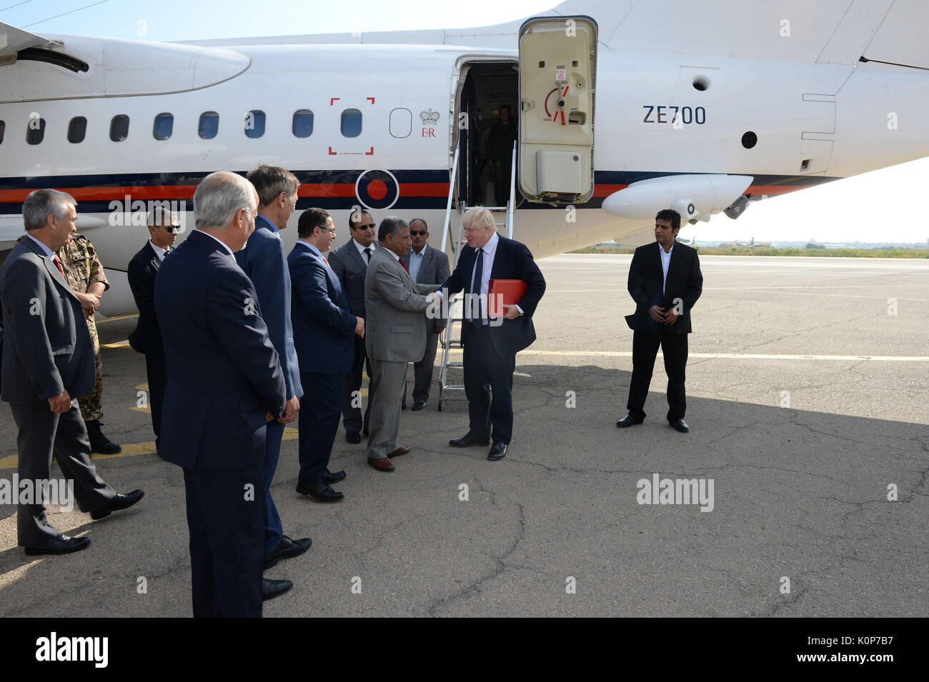 Foreign Secretary Boris Johnson greets dignitaries at the airport in Tripoli, Libya, during his visit to the country. Stock Photo