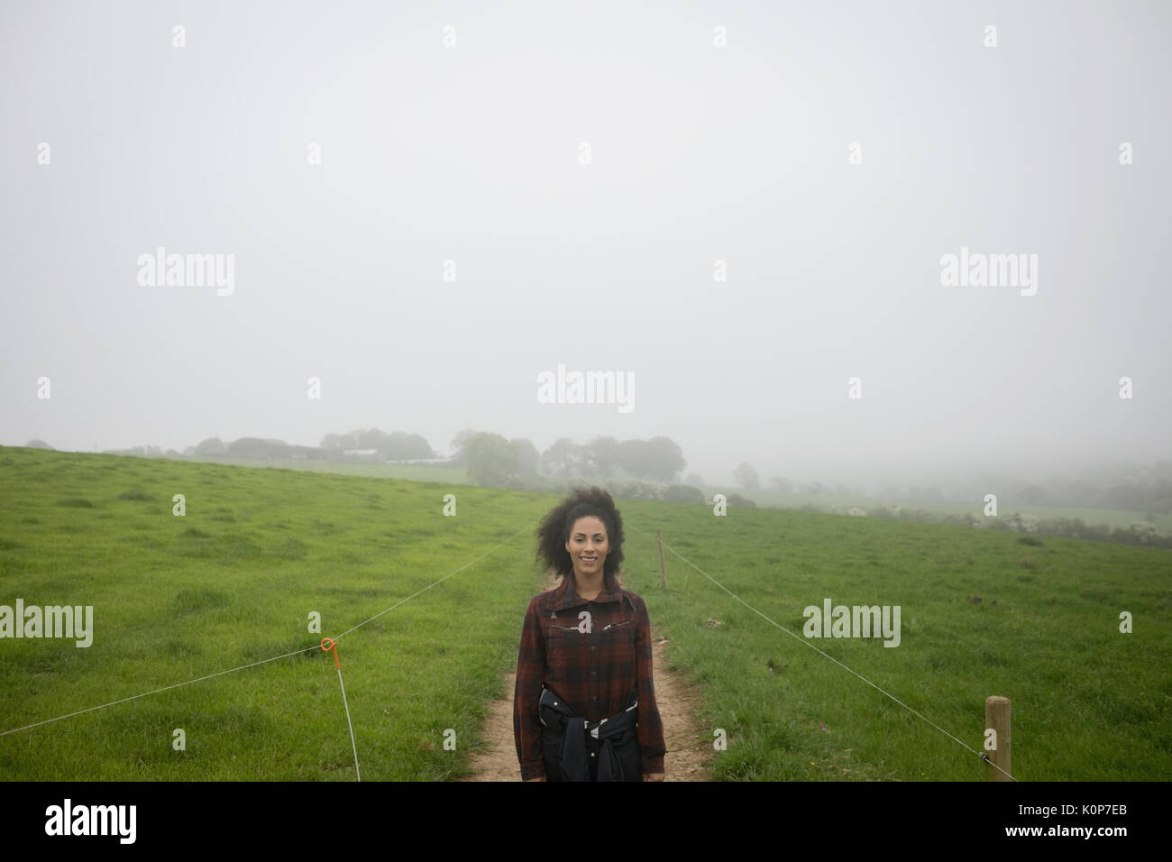 Portrait of female farmer standing in field Stock Photo