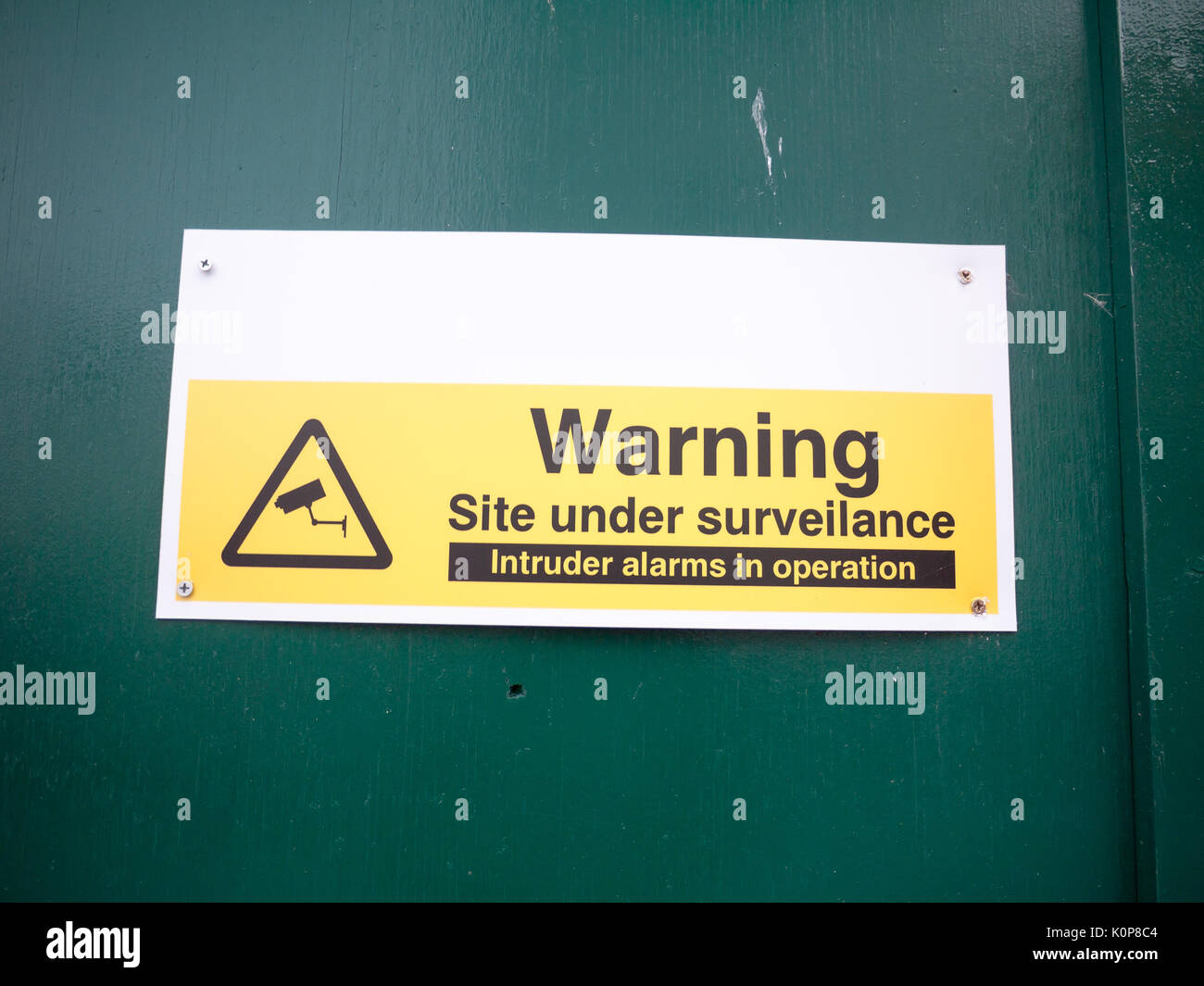 construction site warning site under surveillance cctv; England; UK Stock Photo