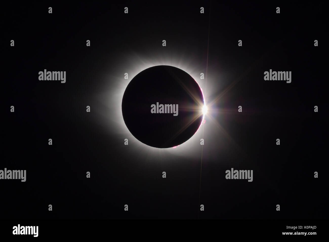 The Sun's corona and the diamond ring effect are visible at the end of the total eclipse phase of the Great American Eclipse on August 21, 2017. Stock Photo