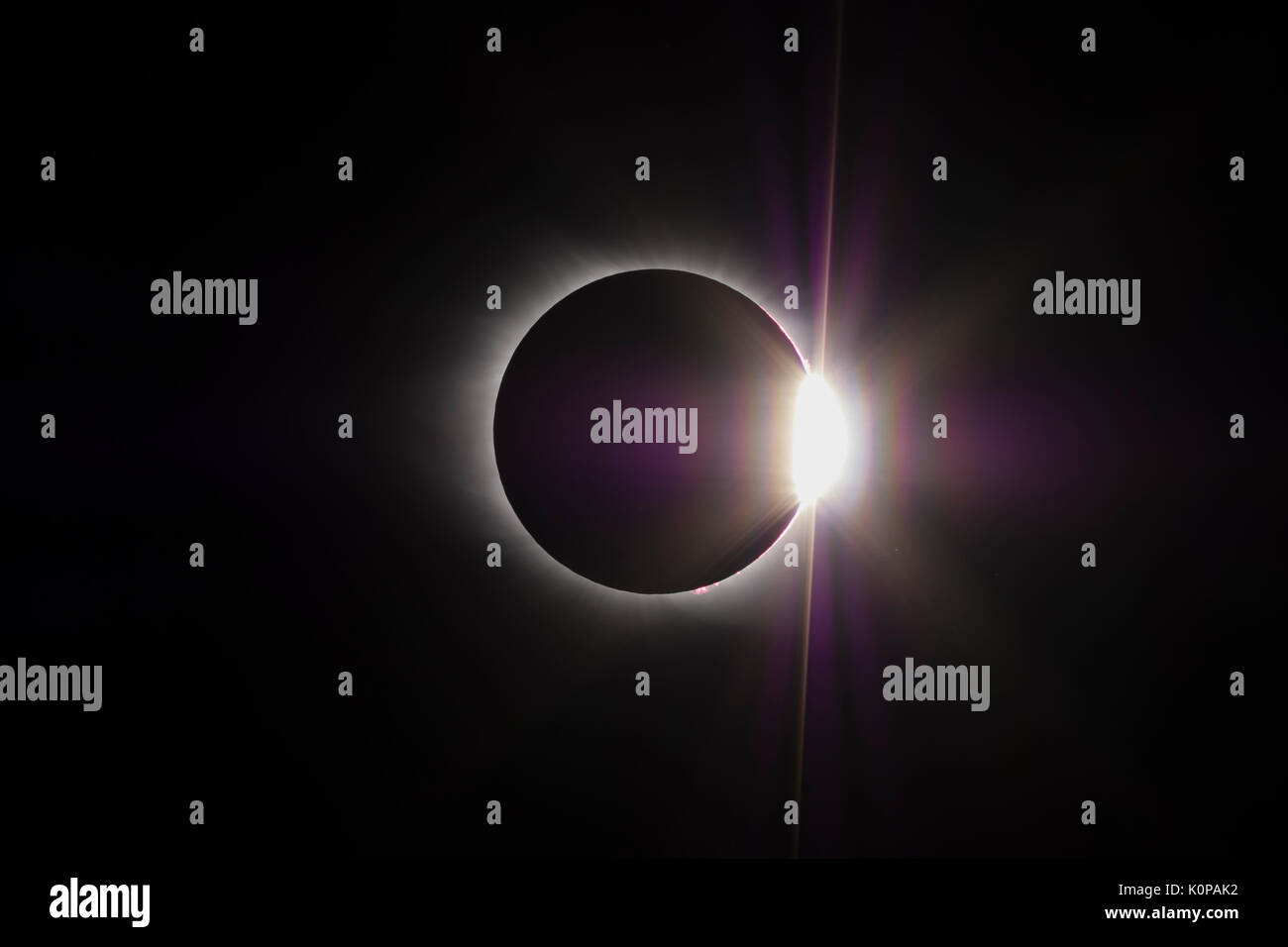 The Sun's corona and the diamond ring effect are visible at the end of the total eclipse phase of the Great American Eclipse on August 21, 2017. Stock Photo