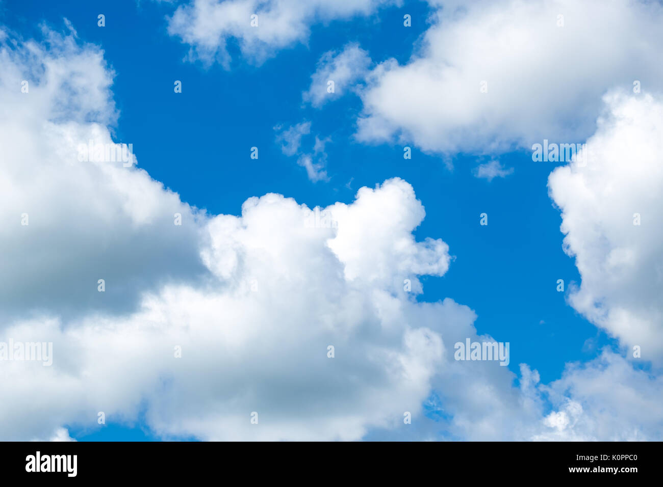 White fluffy clouds in the blue sky Stock Photo - Alamy
