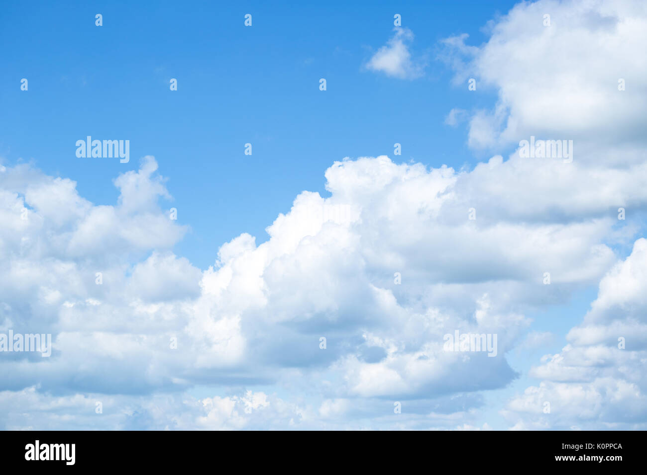 White fluffy clouds in the blue sky Stock Photo - Alamy