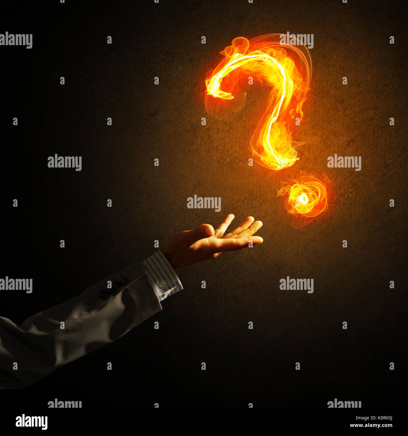Concept of help or support with fire burning question mark Stock Photo