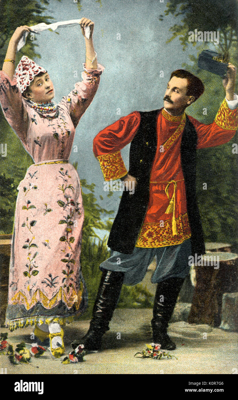 Russian folk dancers holding handkerchief. early 20th century postcard Stock Photo