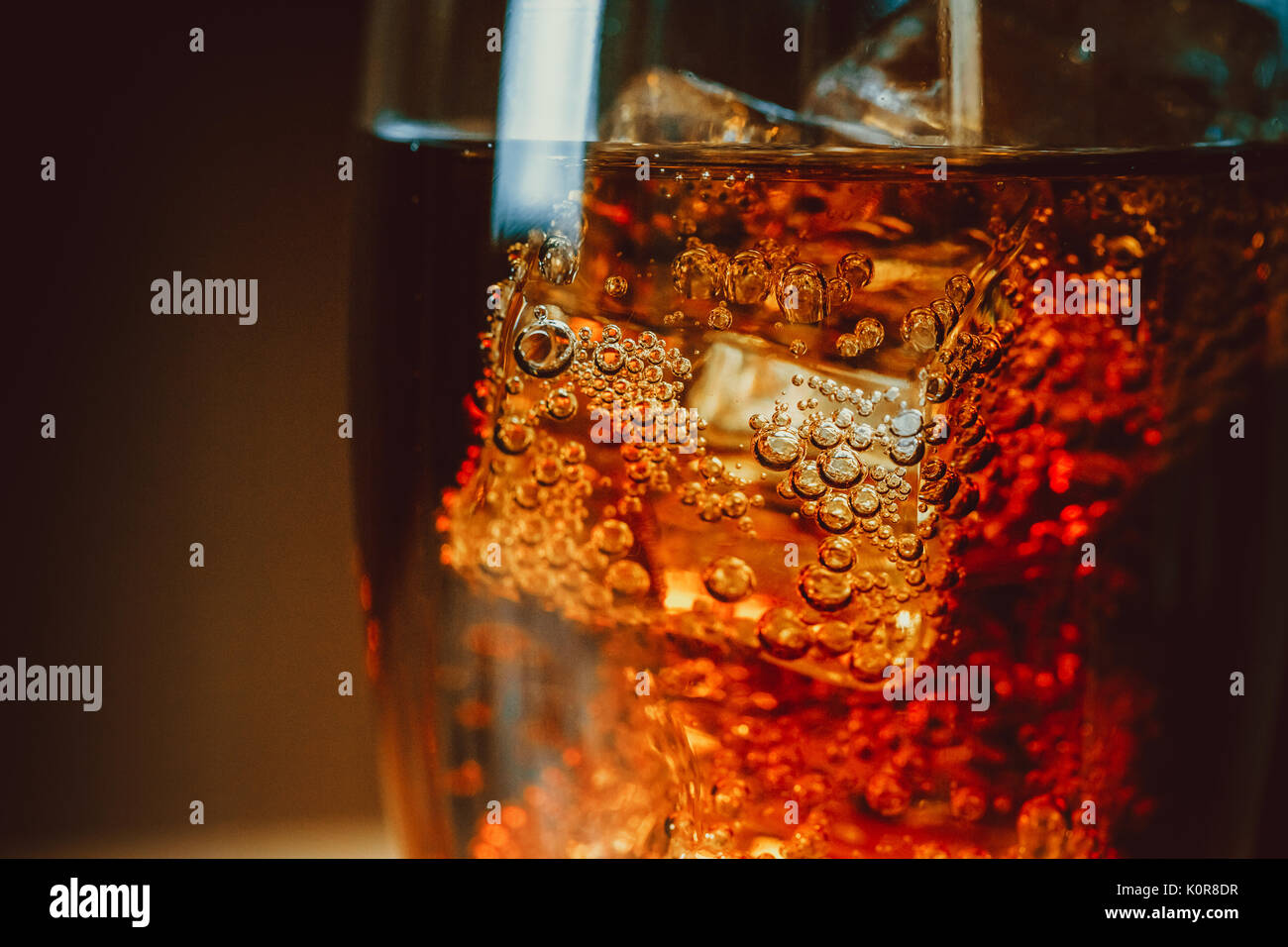 Beautiful cola with ice cubes close up in glass Stock Photo