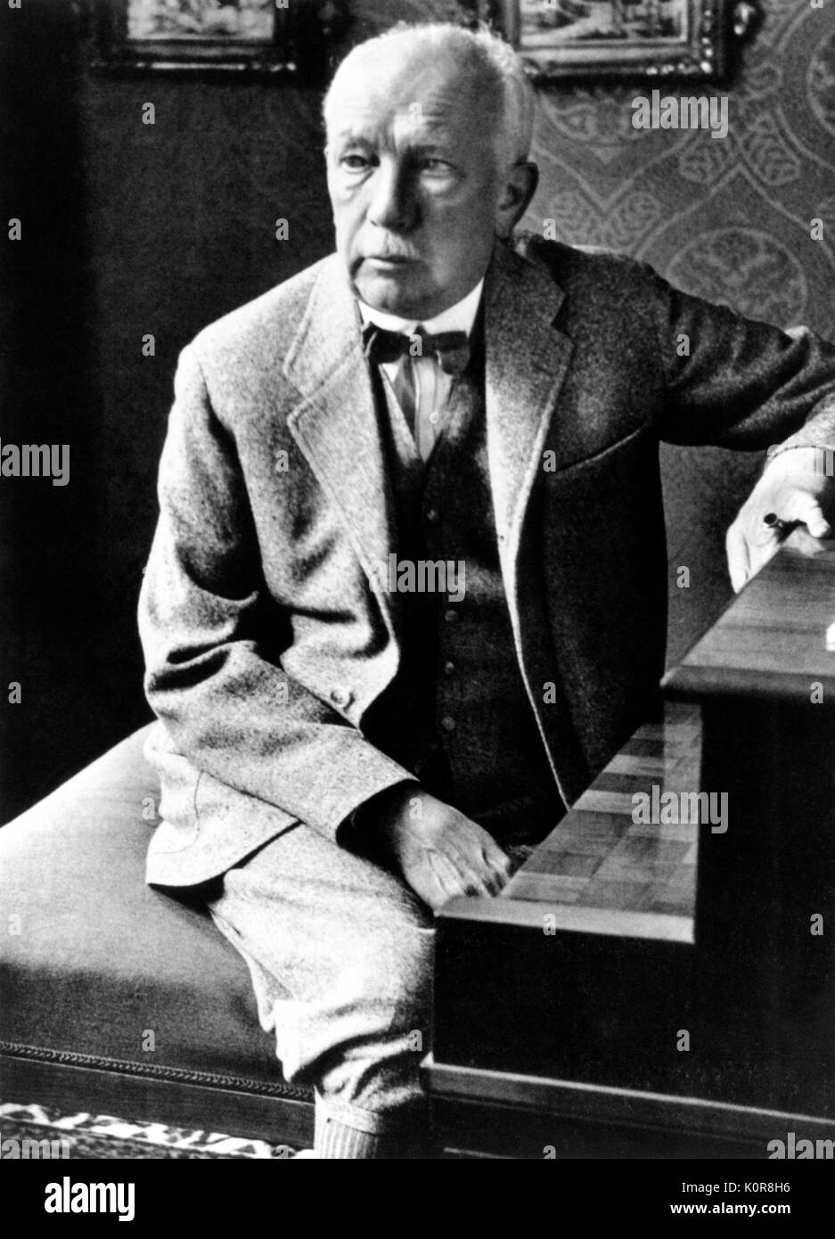 Richard  Strauss seated at the piano wearing plus fours  c.1920s. German composer and conductor. 11 June 1864 - 8 September 1949. Stock Photo