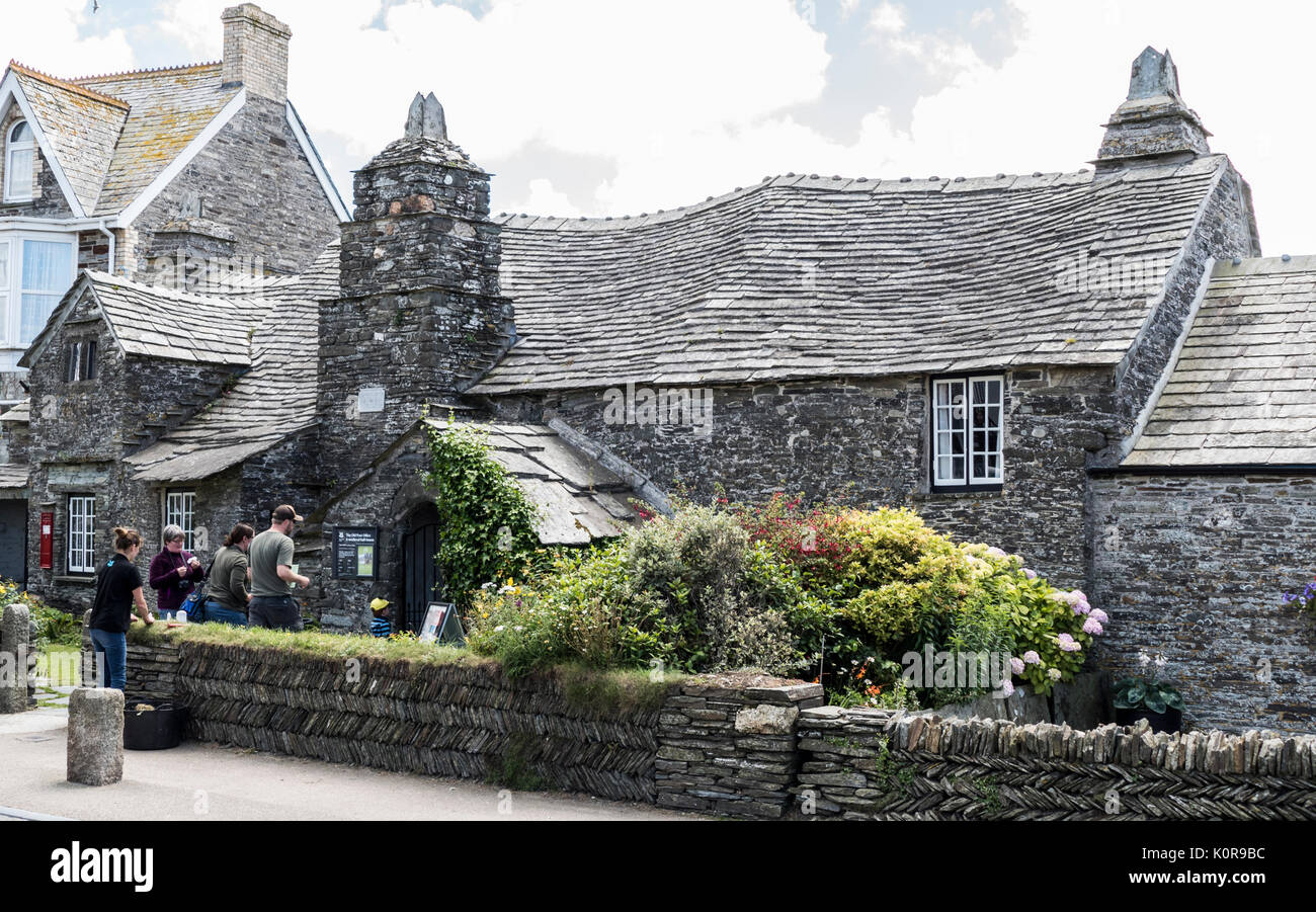 Visitors to the medieval (14th century) Old Post Office, a Grade I listed stone house on Fore Street, Tintagel, Cornwall, England, UK. Stock Photo