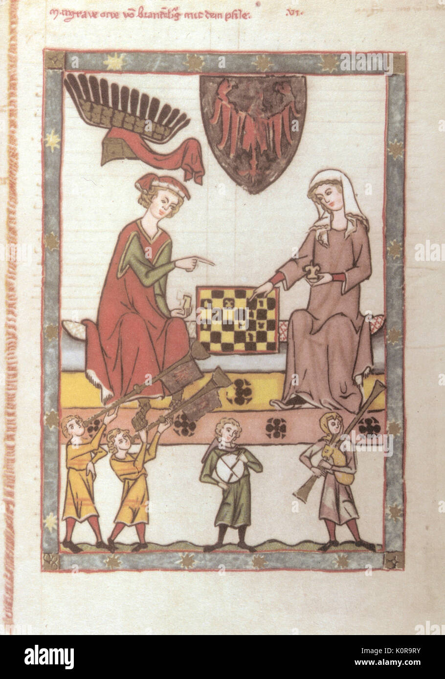 Medieval noble man and noble woman playing game of chess, with musicians playing trumpets, tabor and bagpipes. Illumination Bagpipe / bagpiper. Minnesang. Chivalry. Stock Photo