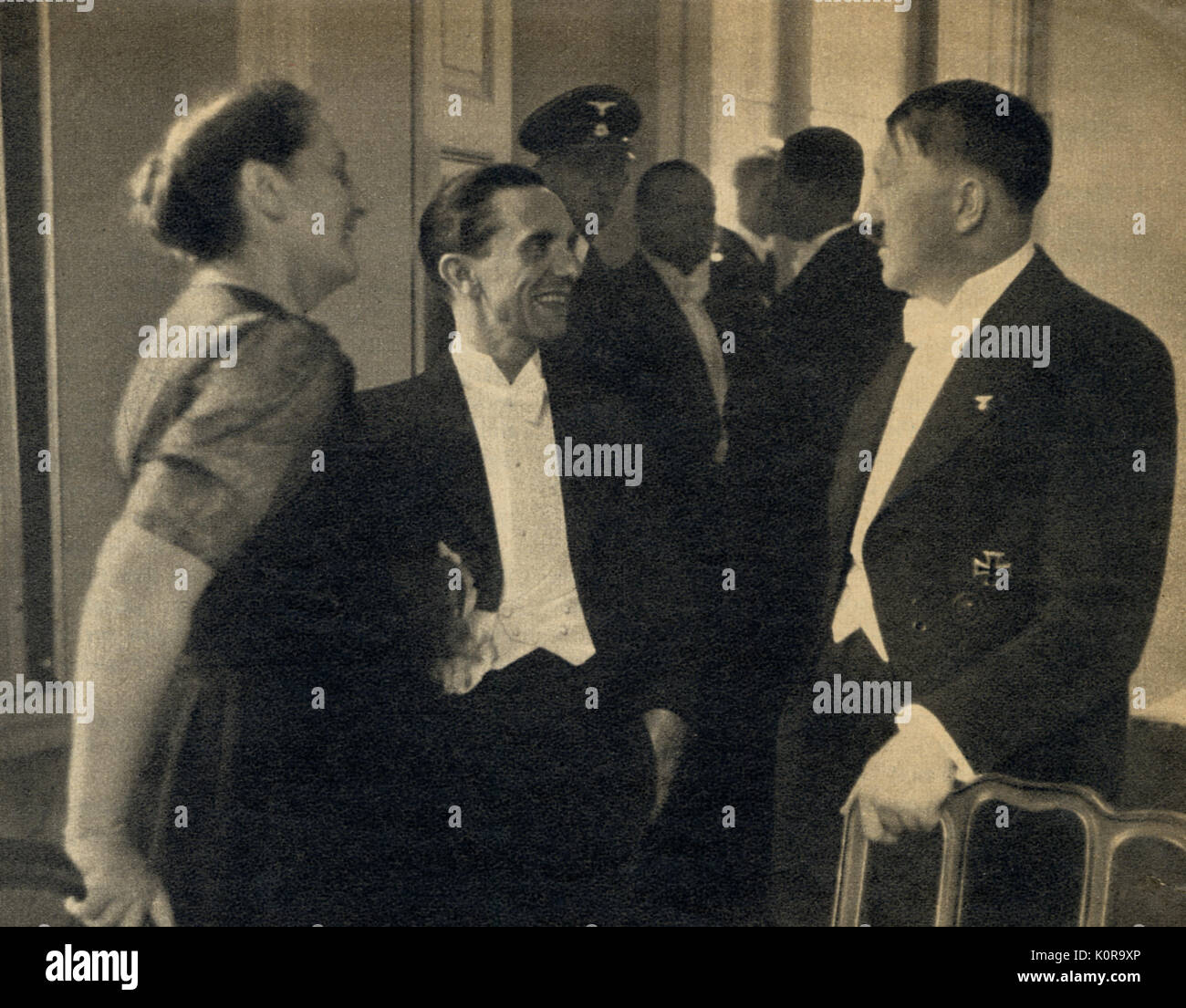 Winifred Wagner with Josef Goebbels &  Adolf Hitler - 3rd August, 1938 at Bayreuth Festspielhaus in conversation and evening dress. Stock Photo