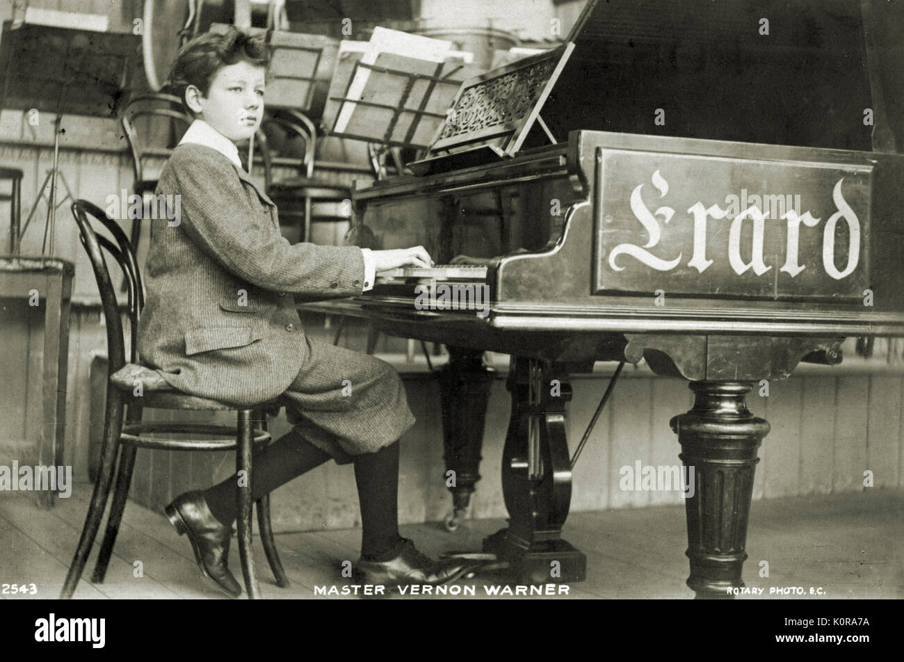 Instruments - Keyboard - Piano. Advert for Erard pianos. Young man playing the piano. Stock Photo