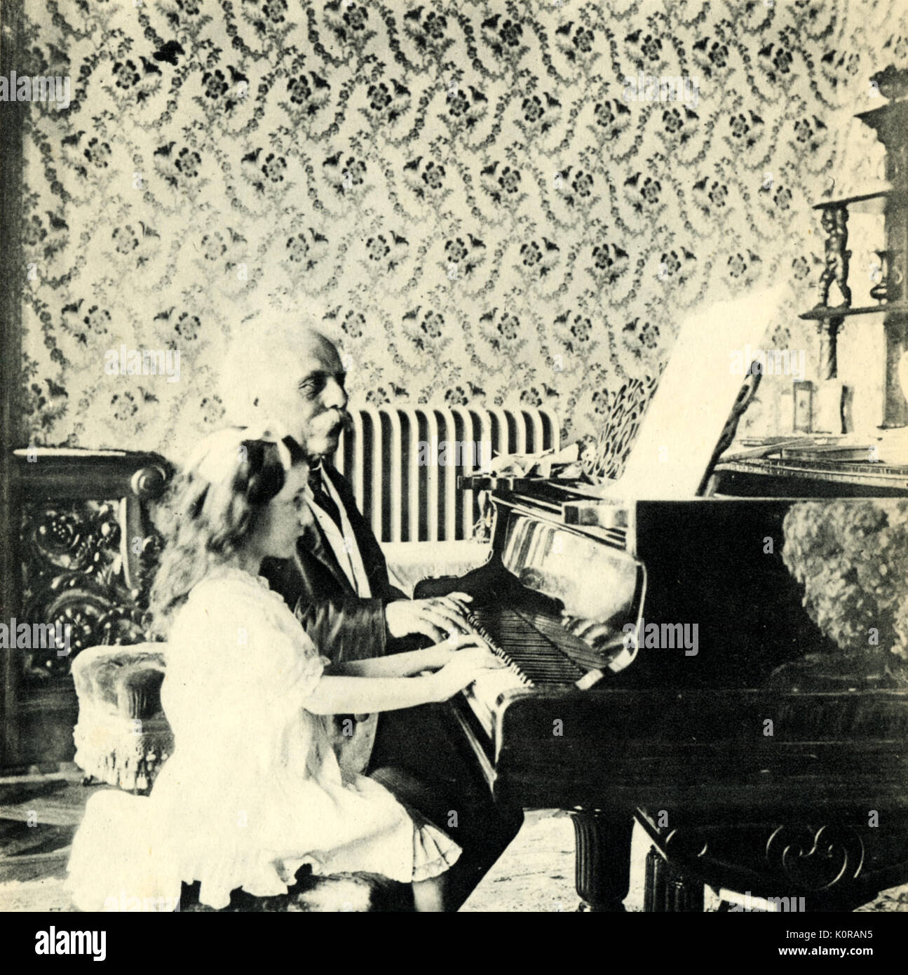 Gabriel FAURÉ, French composer - playing piano duets with Mlle Lombard,  Trévano, 1913. b1845-1924 Stock Photo - Alamy