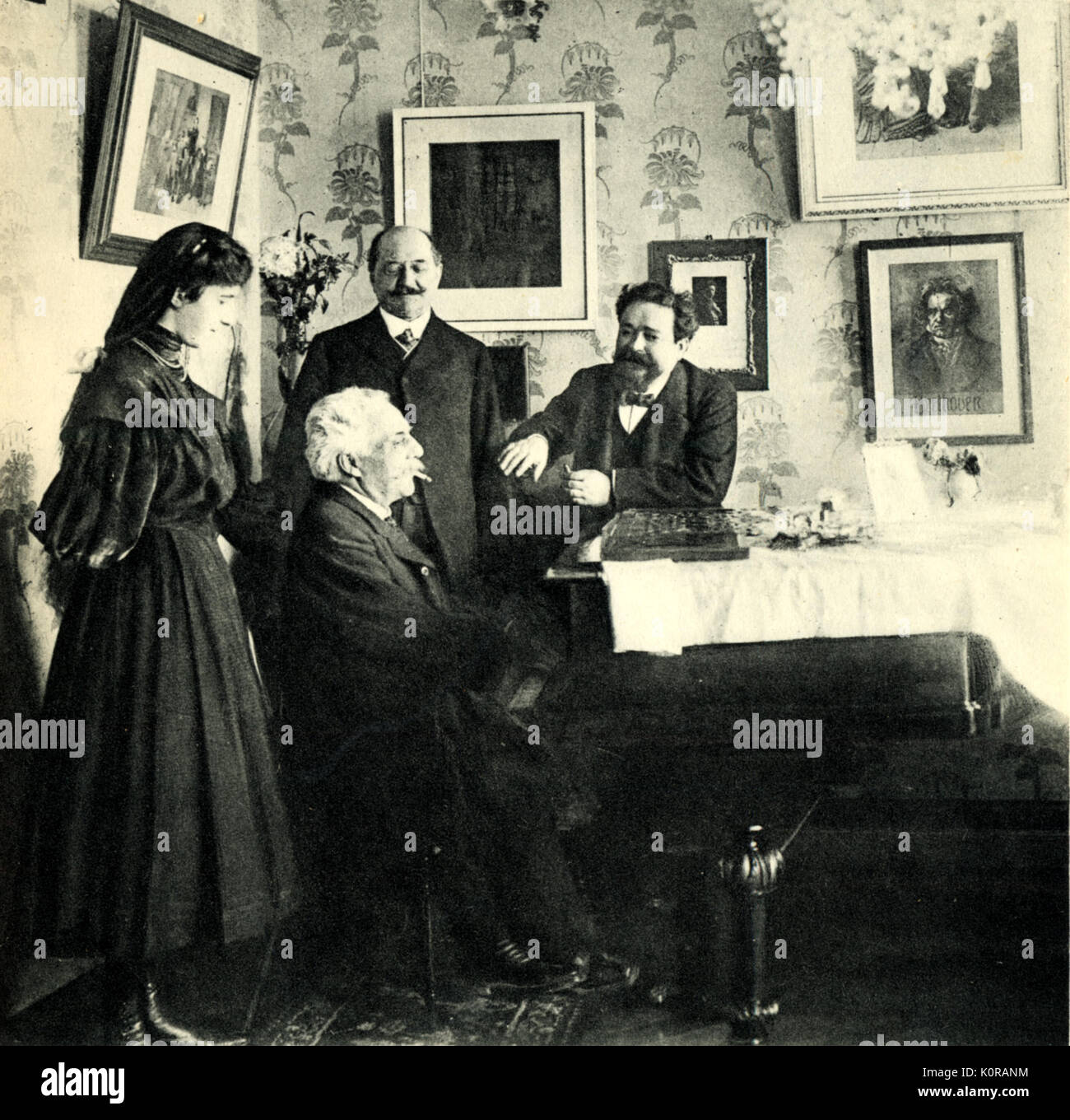Gabriel FAURÉ, French composer, playing the piano at Albeniz' home.  Albeniz' daughter at his side. (GF:1845-1924) Stock Photo