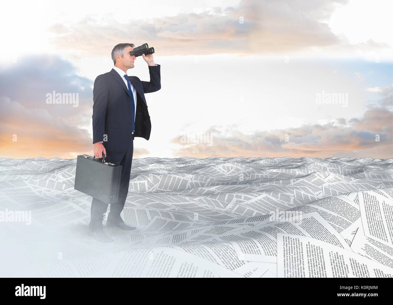 Digital composite of Businessman with binoculars and briefcase in sea of documents under sky clouds Stock Photo