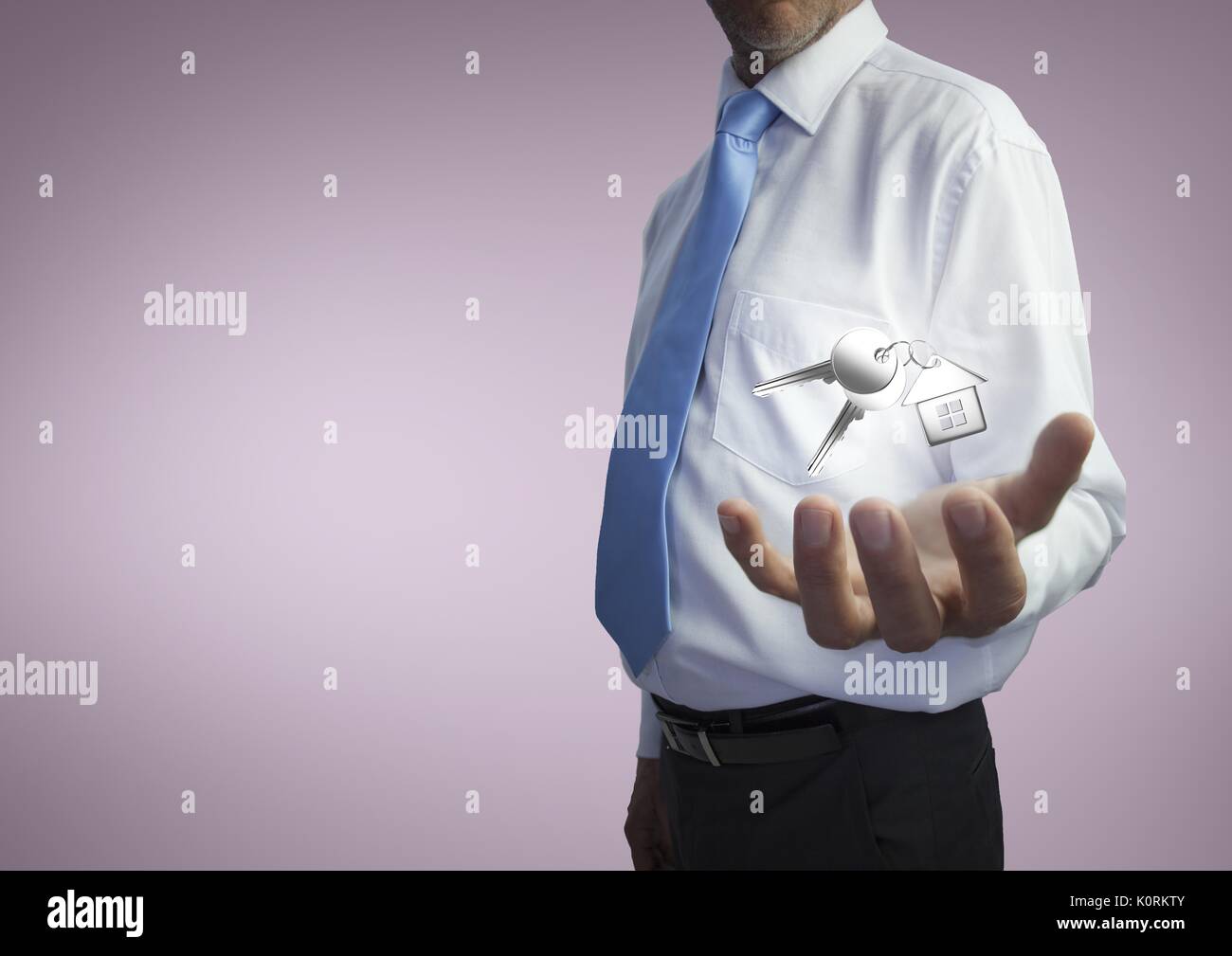 Digital composite of Business man holding keys Stock Photo