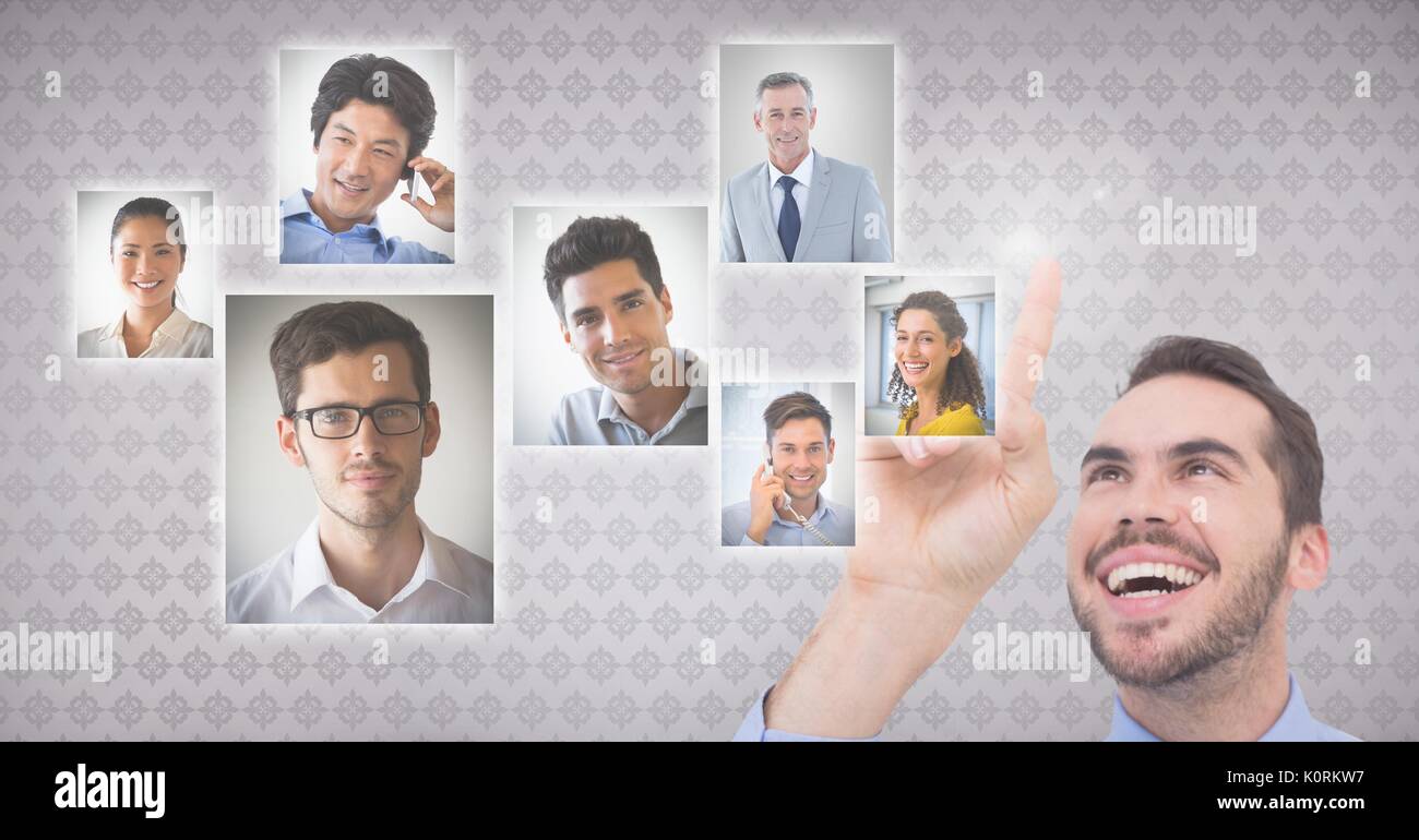 Digital composite of Businessman interacting and choosing a person from group of people interface Stock Photo