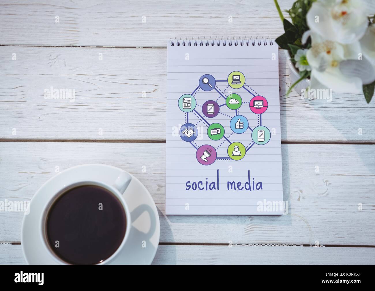 Digital composite of Table top with a notebook with web graphics Stock Photo