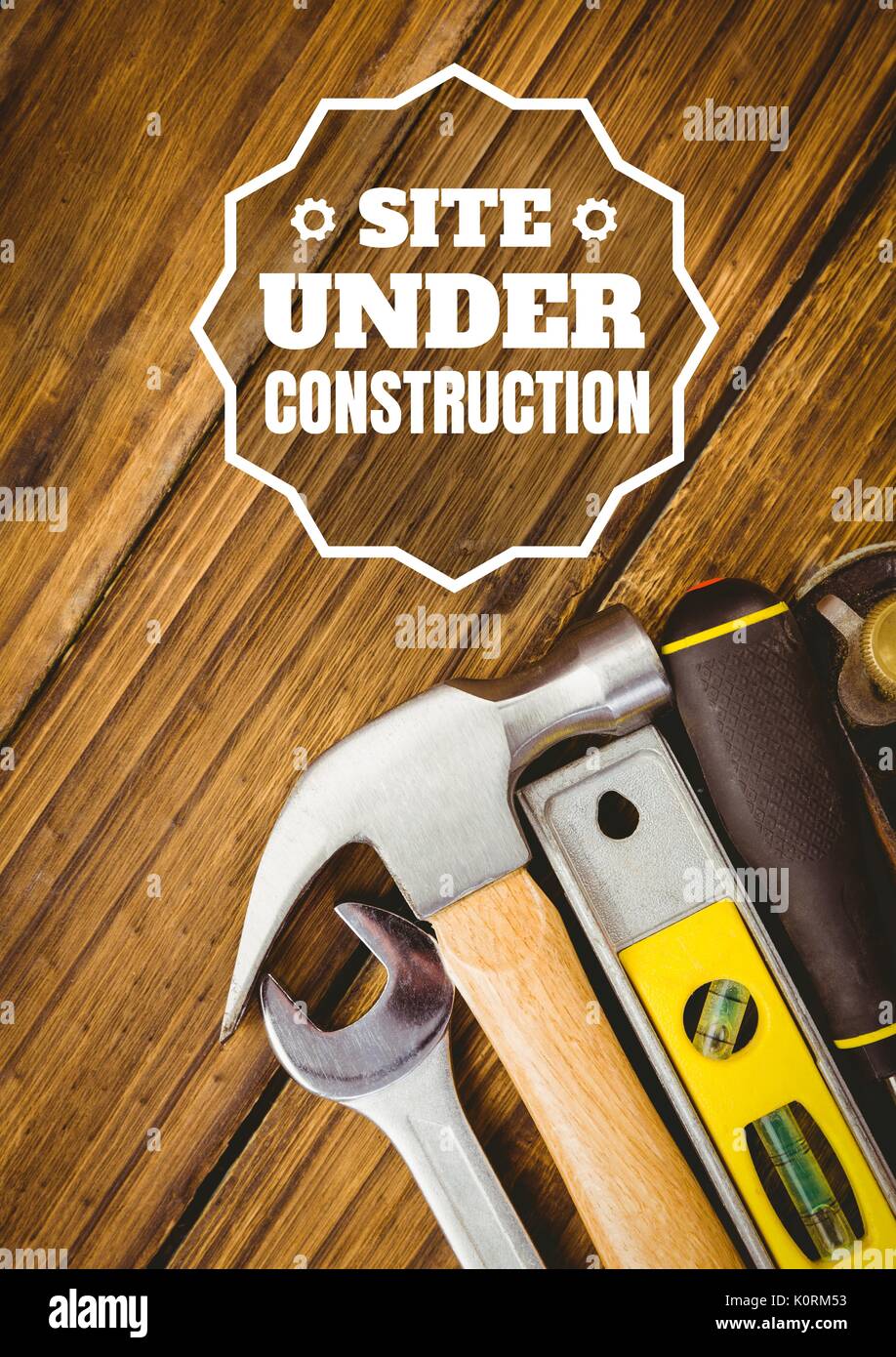 Digital composite of Website under construction text against tools photo Stock Photo