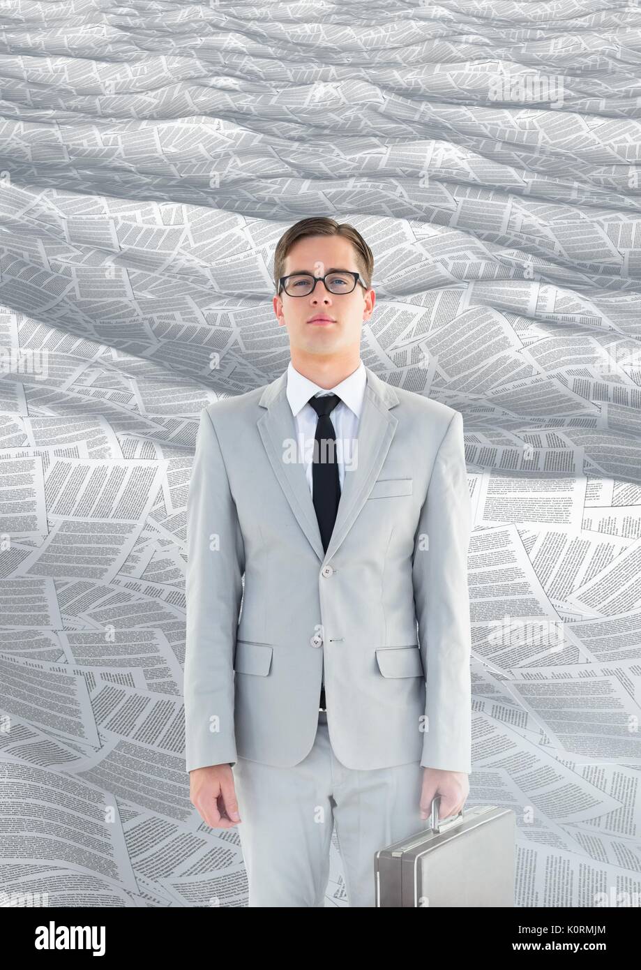 Digital composite of Geeky Businessman in sea of documents with briefcase Stock Photo