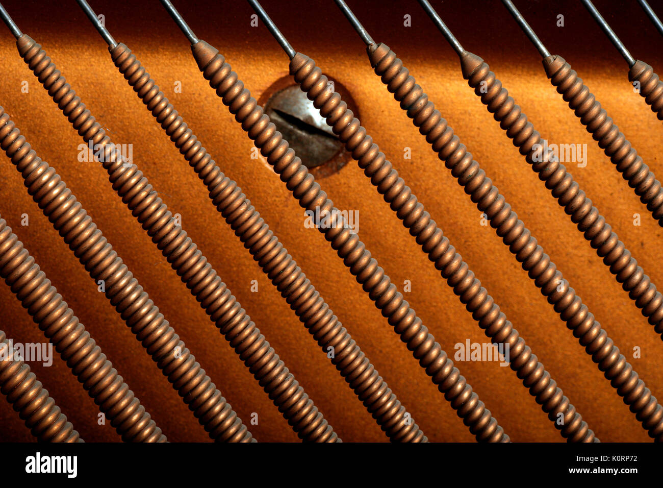 Bass strings from an upright piano - Close-up detail Stock Photo