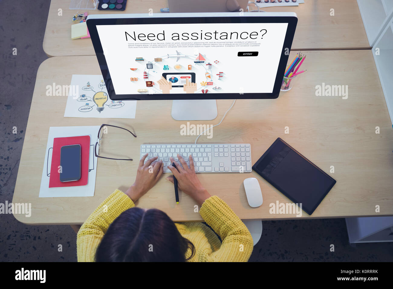 Icons with need assistance text against female graphic designer working ...