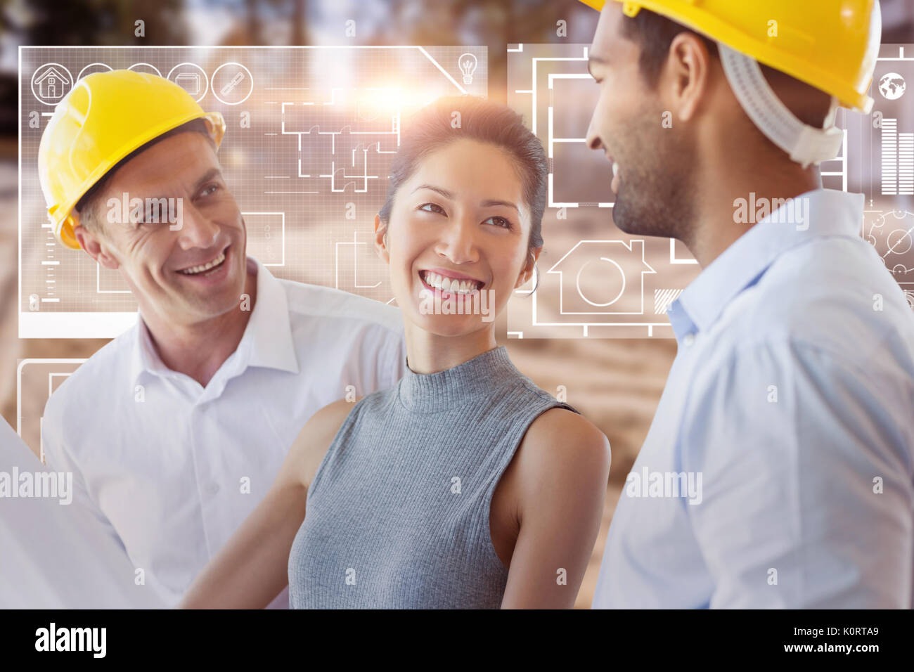 Happy architect discussing over blueprint against high angle view of muddy construction site Stock Photo