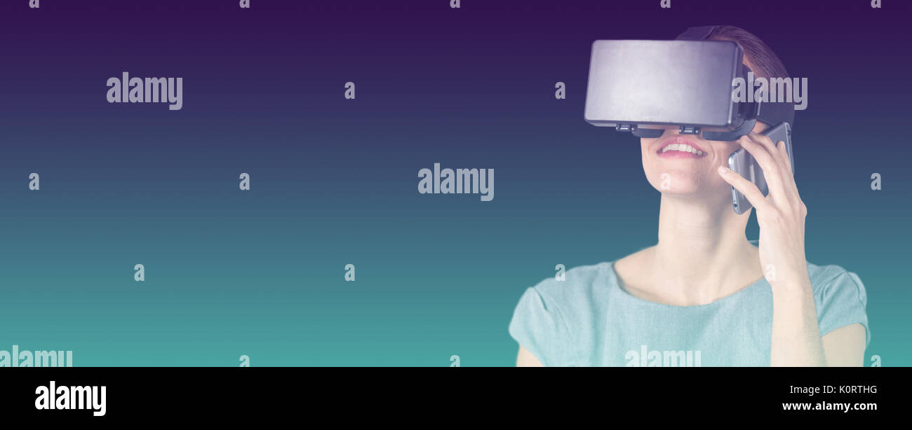 Happy woman talking on mobile phone while using virtual reality headset against turquoise and purple background Stock Photo