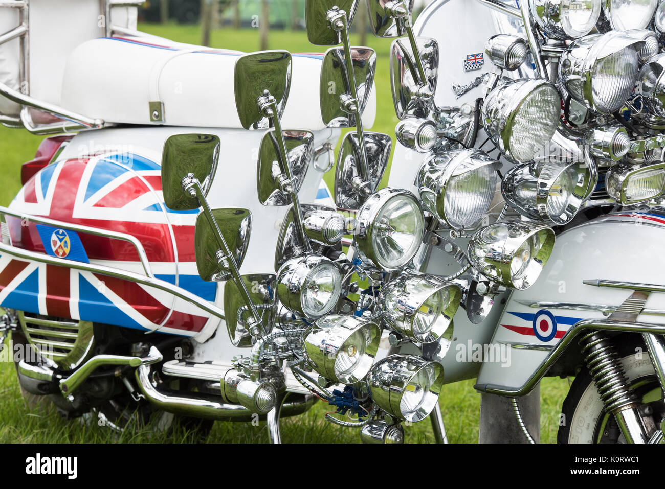Mods vespa custom scooter covered in mirrors and lights. Newbury