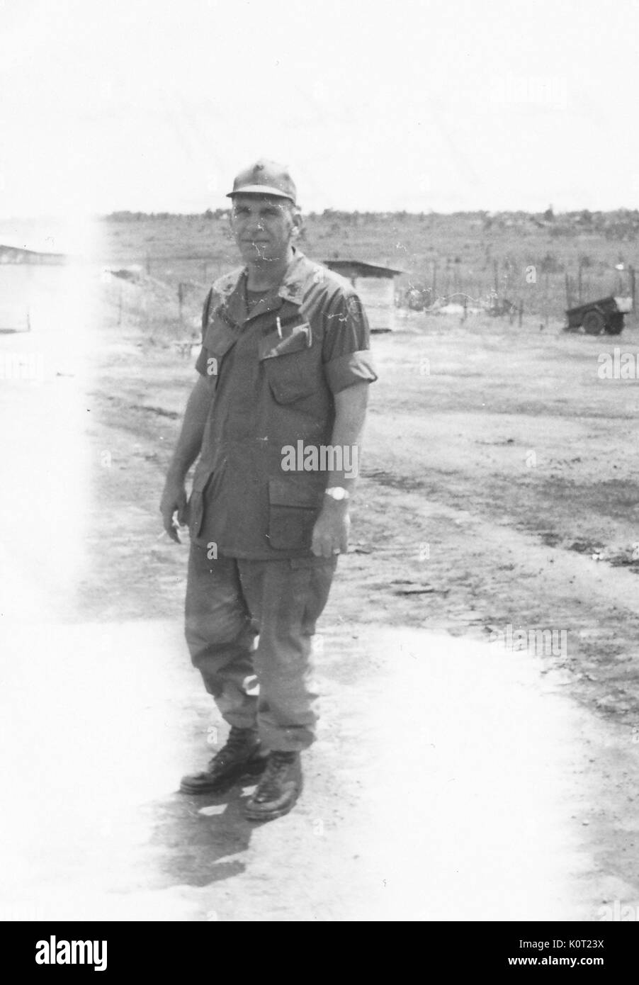 American servicemen Raymond Bergeson standing in military uniform in an airfield in Vietnam during the Vietnam War, a member of Team 3, 1964. Stock Photo