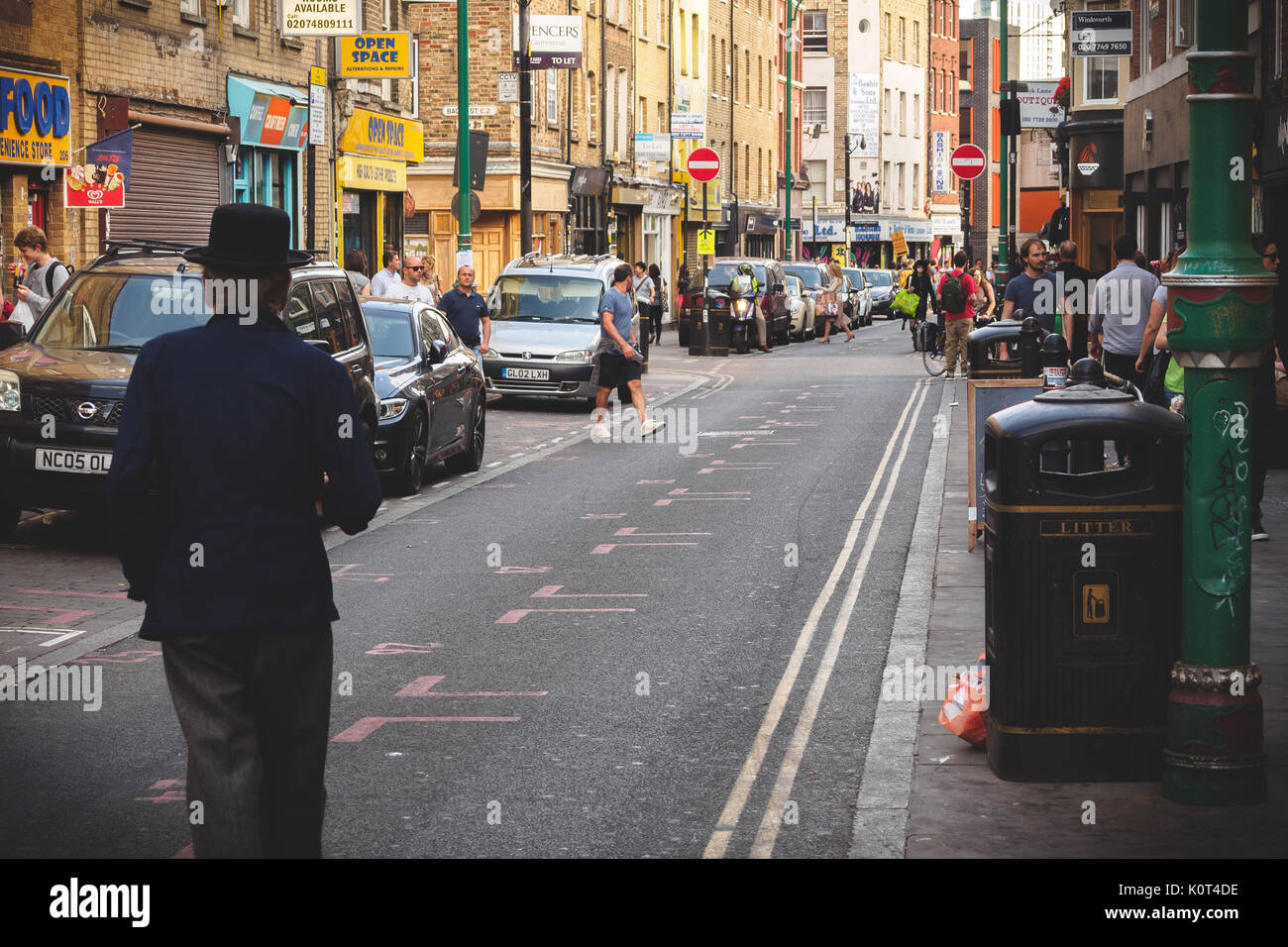 Man walking on Brick Lane in East London (UK). July 2017. Landscape format. Stock Photo